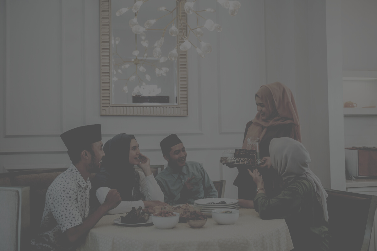 muslim woman serving drink for friend and family after fasting